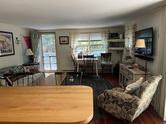 60 R Carol Lane Oak Bluffs, MA 02557 - Photo 7 of 14 a living room with furniture a flat screen tv and floor to ceiling window