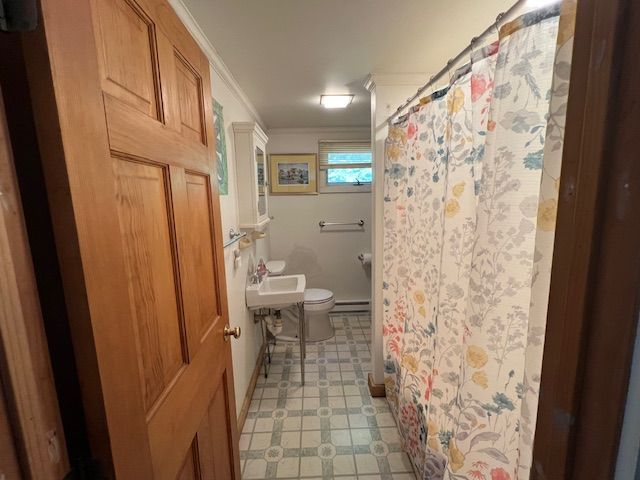 60 R Carol Lane Oak Bluffs, MA 02557 - Photo 10 of 14 a bathroom with a toilet and a shower curtain