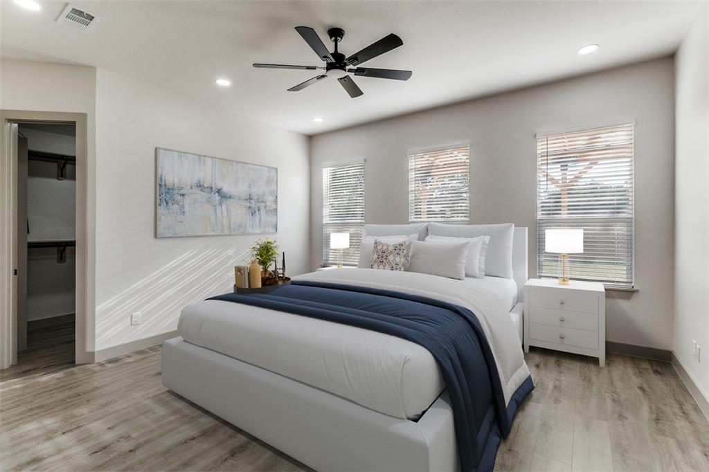 917 South Carroll Avenue Dallas, TX 75223 - Photo 12 of 30 Bedroom featuring a walk in closet, light wood-style flooring, recessed lighting, and a ceiling fan
