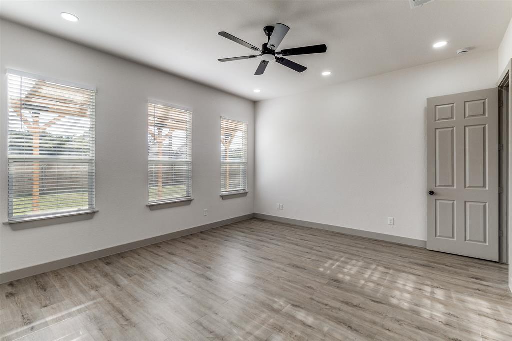 917 South Carroll Avenue Dallas, TX 75223 - Photo 13 of 30 Spare room with recessed lighting, light wood-style flooring, and a ceiling fan