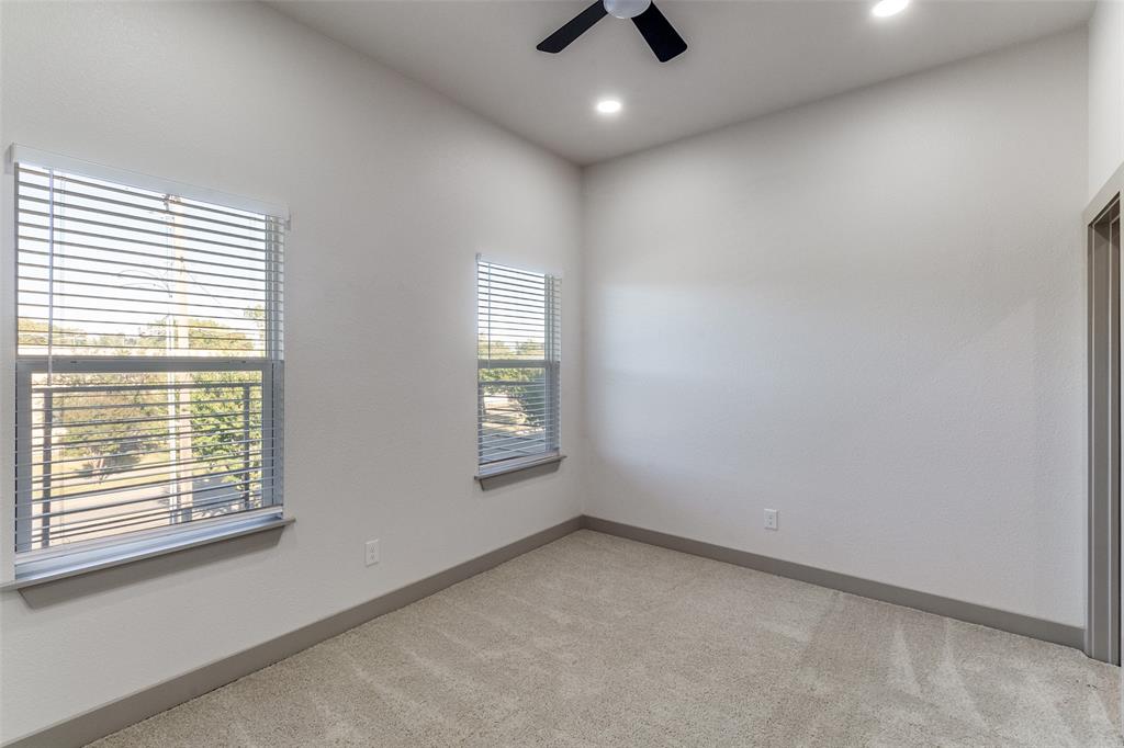 917 South Carroll Avenue Dallas, TX 75223 - Photo 17 of 30 Empty room featuring light carpet, recessed lighting, and ceiling fan