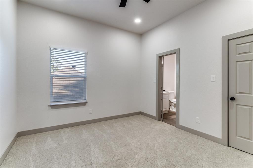 917 South Carroll Avenue Dallas, TX 75223 - Photo 18 of 30 Unfurnished bedroom featuring light carpet, ensuite bath, ceiling fan, and recessed lighting