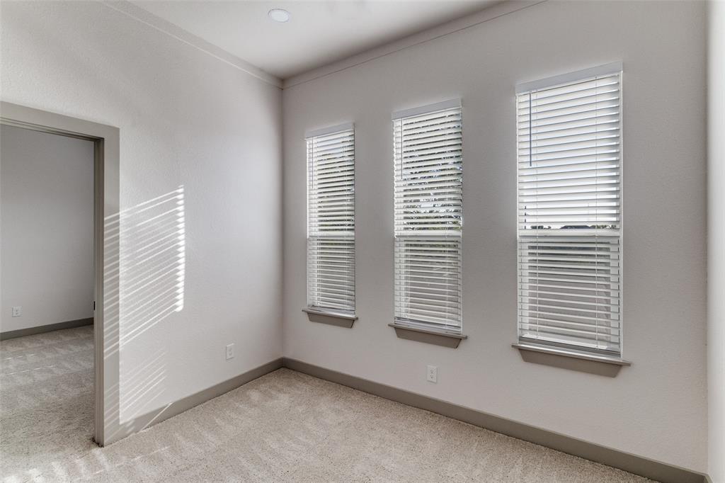 917 South Carroll Avenue Dallas, TX 75223 - Photo 25 of 30 Unfurnished room featuring light carpet and baseboards