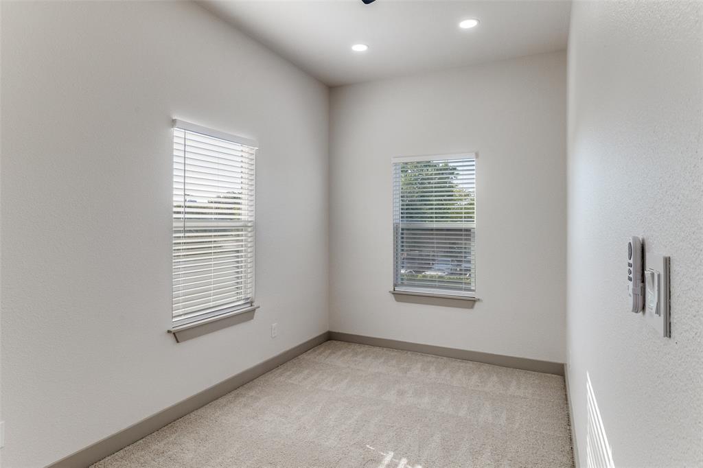 917 South Carroll Avenue Dallas, TX 75223 - Photo 26 of 30 Spare room with light carpet, recessed lighting, and a textured wall
