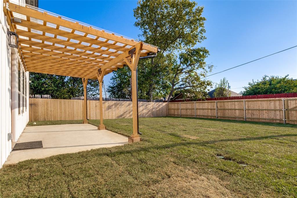 917 South Carroll Avenue Dallas, TX 75223 - Photo 29 of 30 Fenced backyard featuring a pergola and a patio area