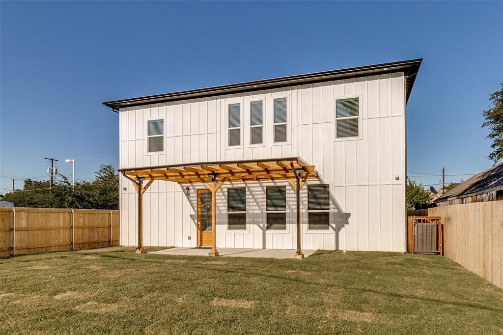 917 South Carroll Avenue Dallas, TX 75223 - Photo 30 of 30 Rear view of property featuring a pergola, a fenced backyard, a patio, and board and batten siding