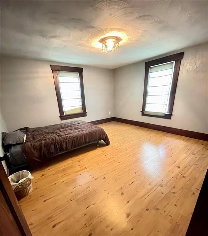 462 Mecklem Avenue Rochester, PA 15074 - Photo 15 of 18 a bedroom with a bed and a window