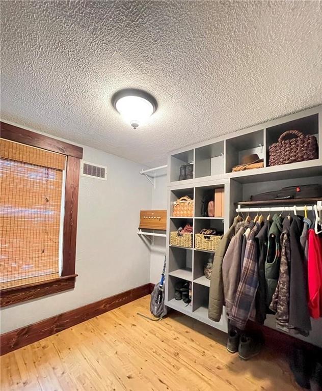 462 Mecklem Avenue Rochester, PA 15074 - Photo 16 of 18 a view of walk in closet with clothes and shoes