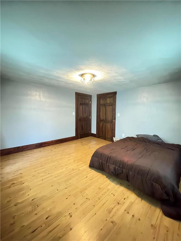 462 Mecklem Avenue Rochester, PA 15074 - Photo 10 of 18 a bedroom with a bed and a cabinets