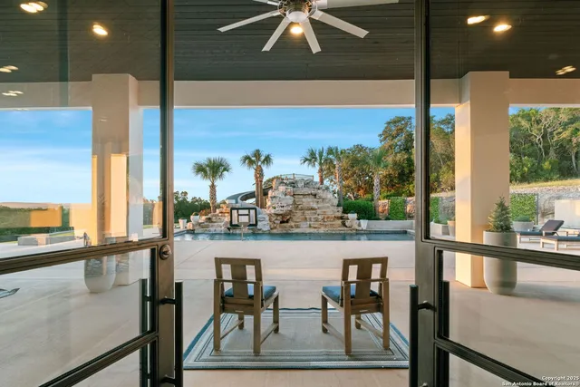 a view of a dining room with furniture and window