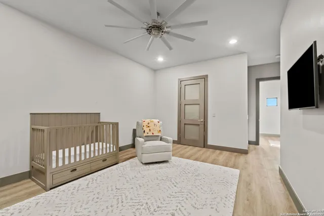 a bedroom with furniture and a window