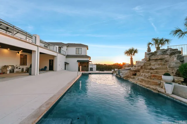 a view of a house with pool porch and patio