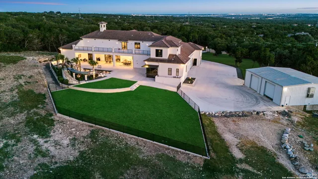 an aerial view of a house with a garden