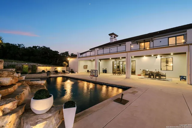 a view of a swimming pool and lounge chair