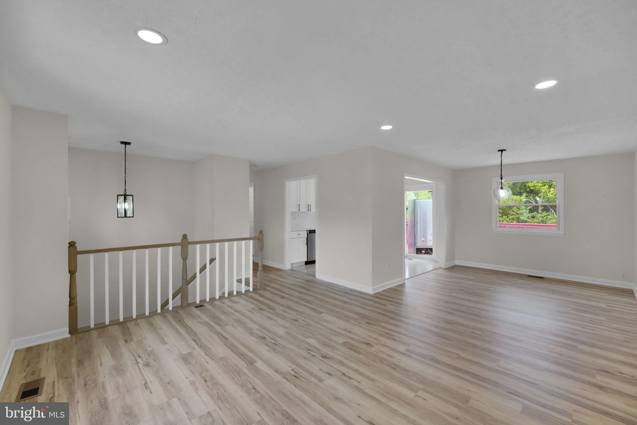 8613 Weems Road Manassas, VA 20110 - Photo 43 of 50 an empty room with wooden floor and windows