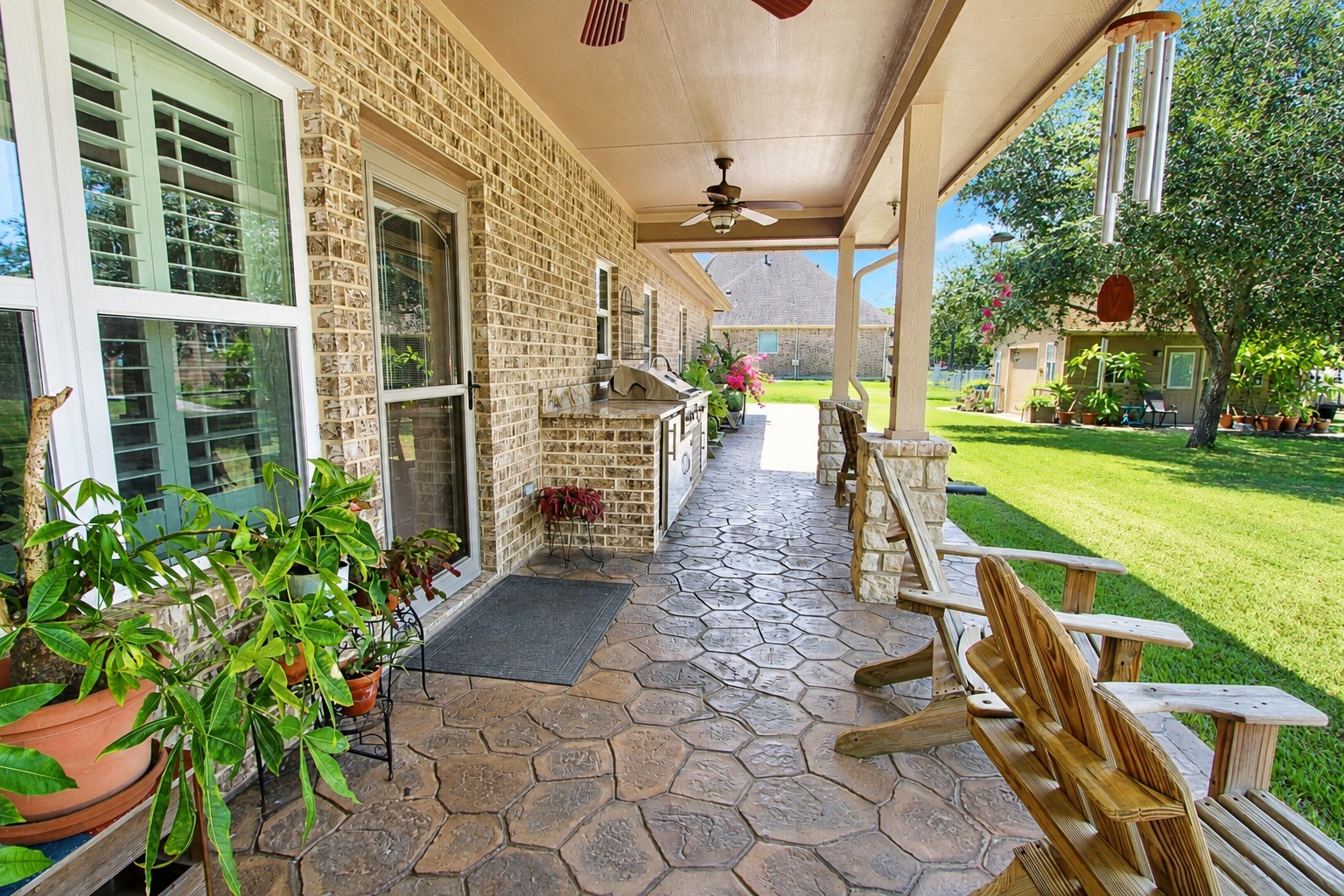 7502 Lewis Lane Manvel, TX 77578 - Photo 39 of 50 The pretty covered back porch features an outdoor kitchen.