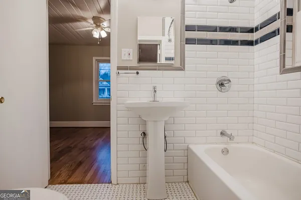a bathroom with a bathtub and shower