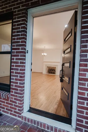 a view of living room with furniture and a flat screen tv