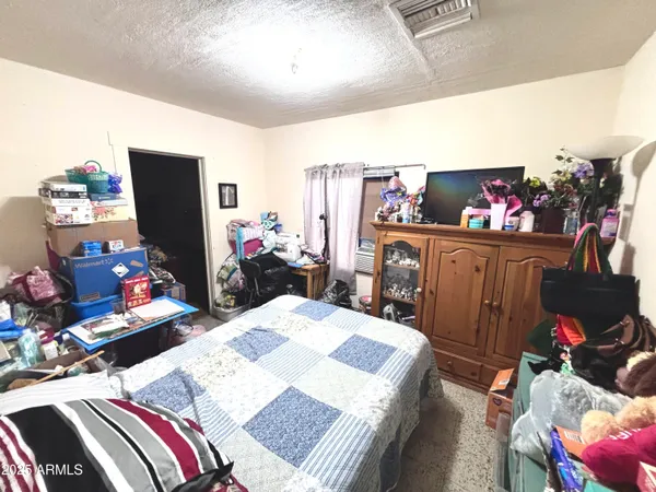 a view of a dining room with furniture and a flat screen tv
