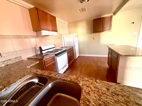 a living room with a bed furniture and a window