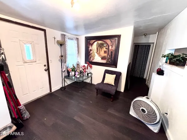 a view of living room with furniture and a window