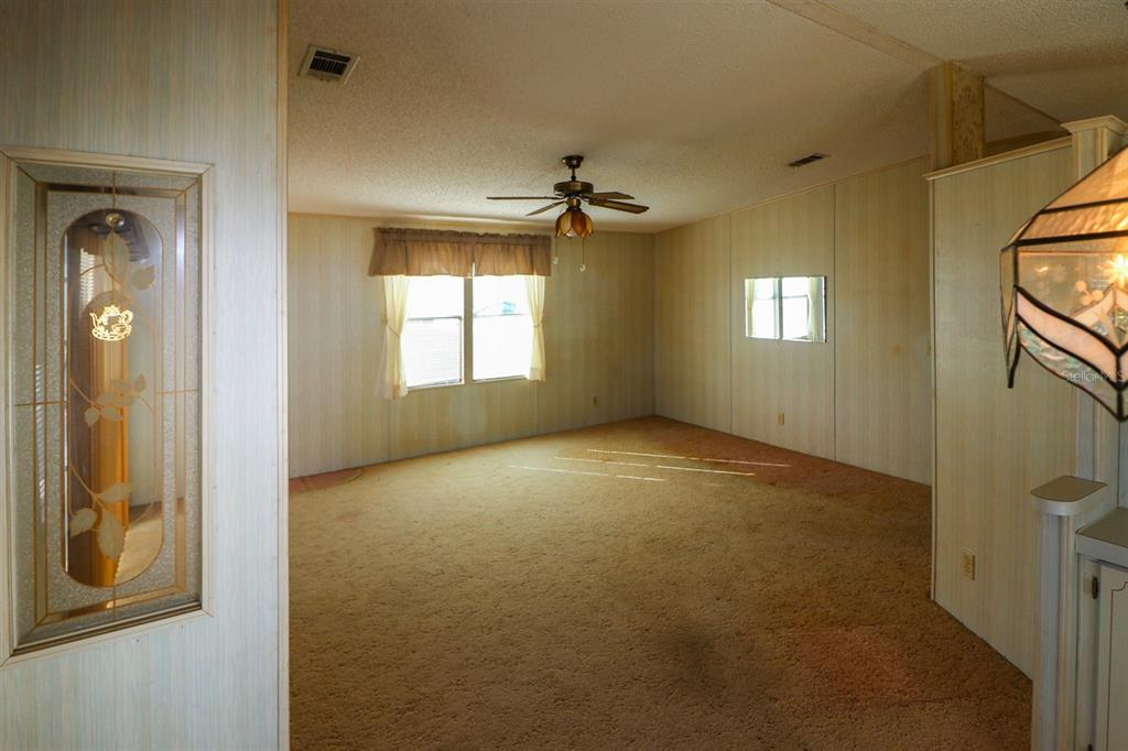 29200 South Jones Loop Road, Unit 176 Punta Gorda, FL 33950 - Photo 11 of 31 a view of empty room with windows