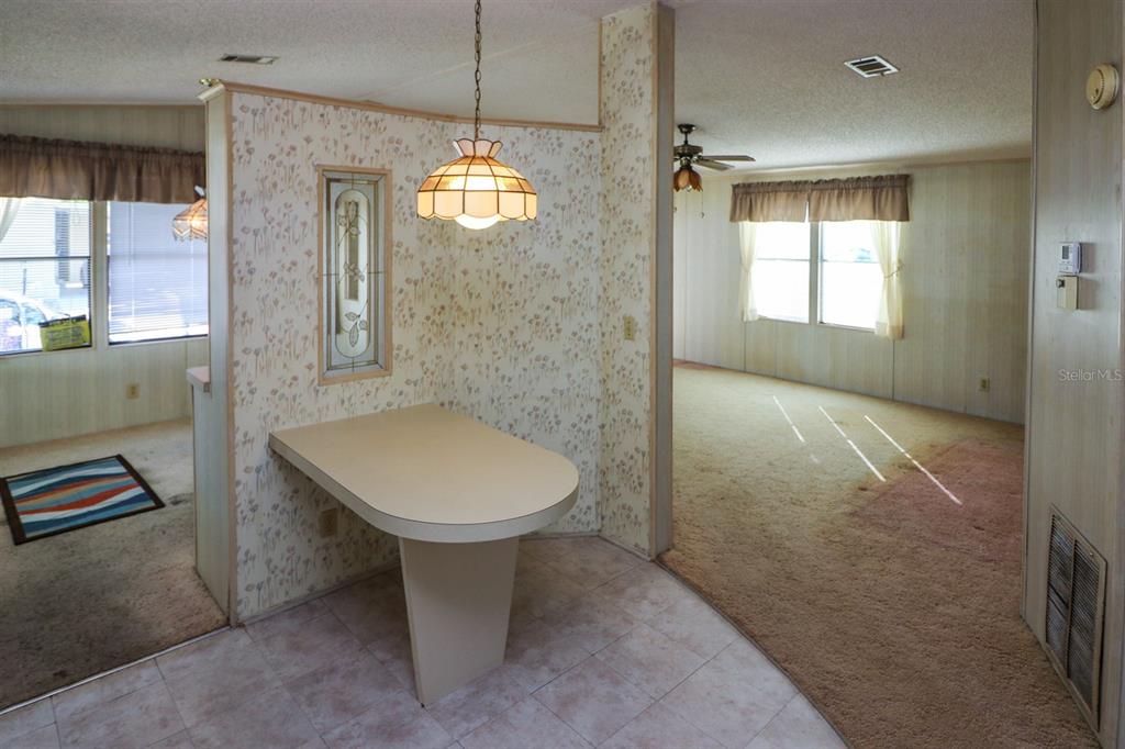29200 South Jones Loop Road, Unit 176 Punta Gorda, FL 33950 - Photo 15 of 31 a bathroom with a toilet sink and shower
