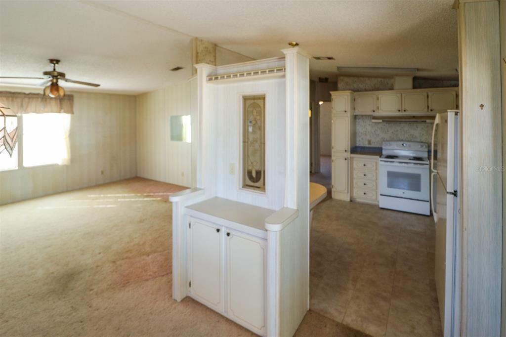 29200 South Jones Loop Road, Unit 176 Punta Gorda, FL 33950 - Photo 16 of 31 a bathroom with a shower sink and mirror
