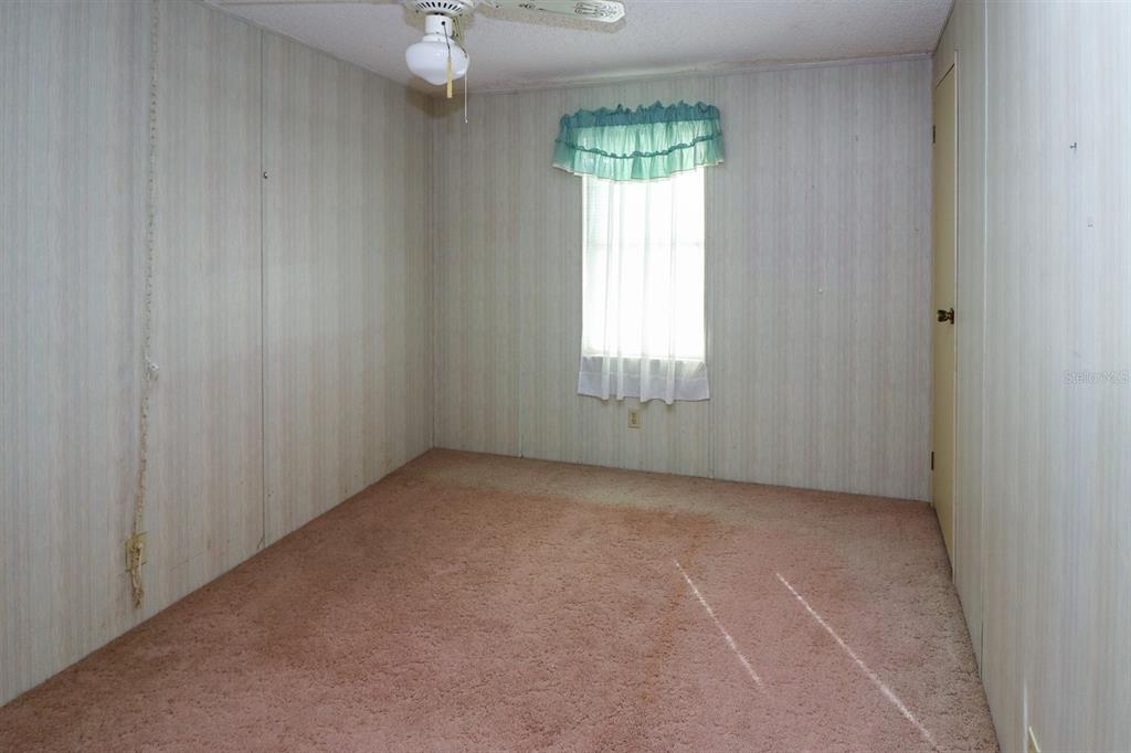 29200 South Jones Loop Road, Unit 176 Punta Gorda, FL 33950 - Photo 18 of 31 an empty room with windows