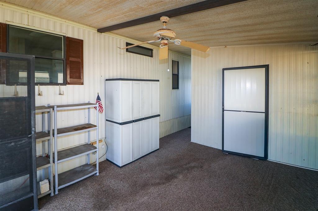 29200 South Jones Loop Road, Unit 176 Punta Gorda, FL 33950 - Photo 21 of 31 a view of an empty room with a cabinet
