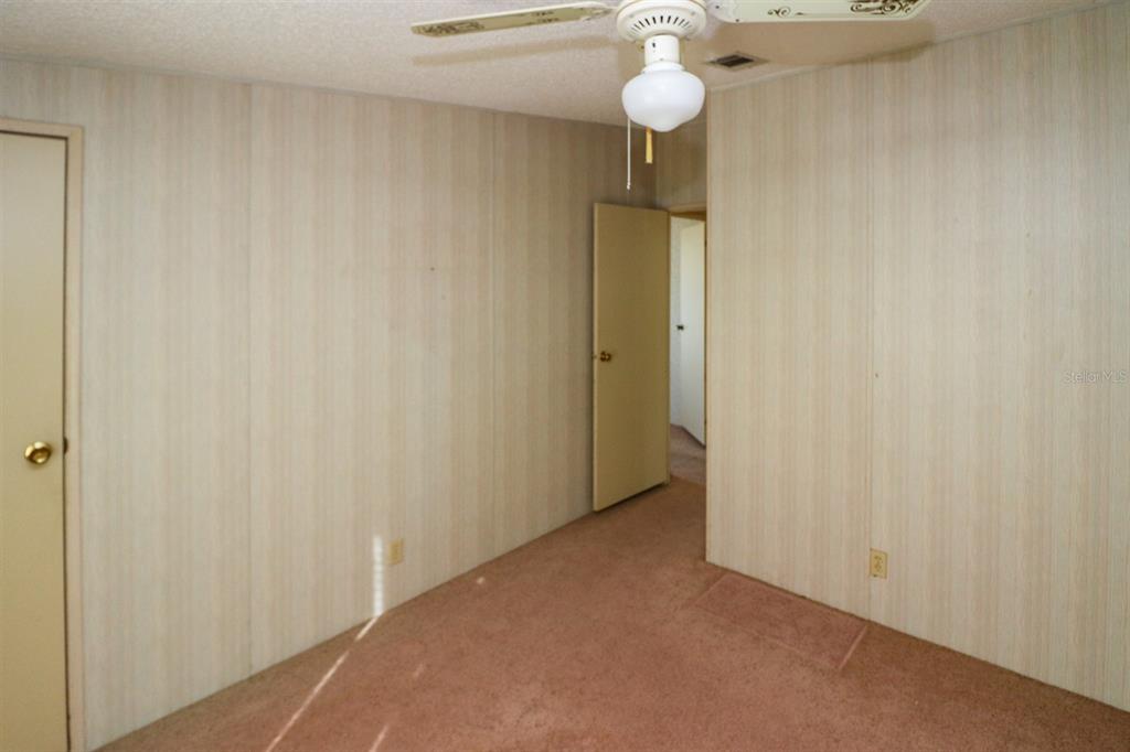 29200 South Jones Loop Road, Unit 176 Punta Gorda, FL 33950 - Photo 28 of 31 a view of an empty room and a window