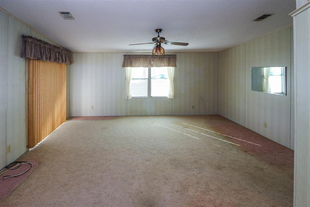29200 South Jones Loop Road, Unit 176 Punta Gorda, FL 33950 - Photo 9 of 31 a view of an empty room with a window