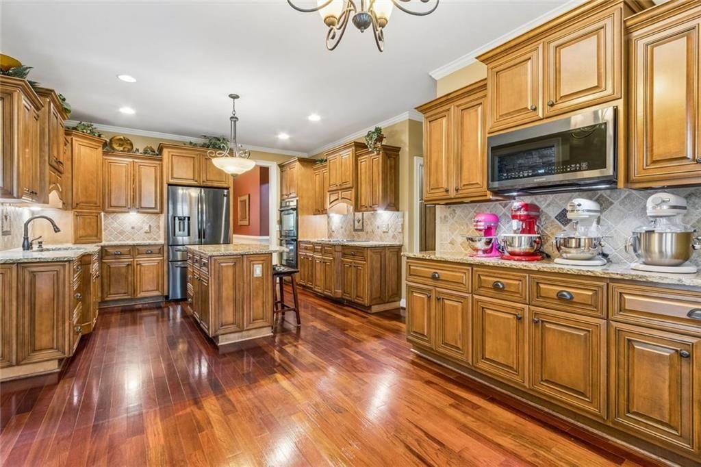 20 Stampede Pass Rydal, GA 30171 - Photo 2 of 77 a kitchen with lots of counter top space and wooden floor