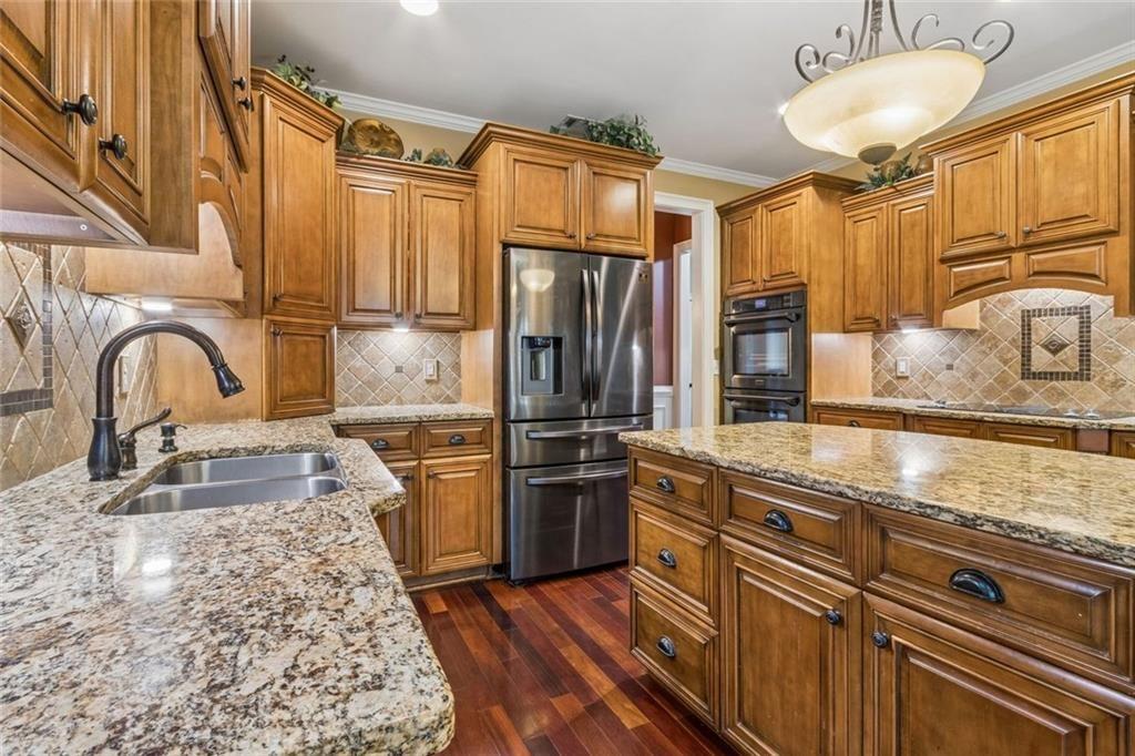 20 Stampede Pass Rydal, GA 30171 - Photo 25 of 77 a kitchen with stainless steel appliances granite countertop a sink stove and refrigerator