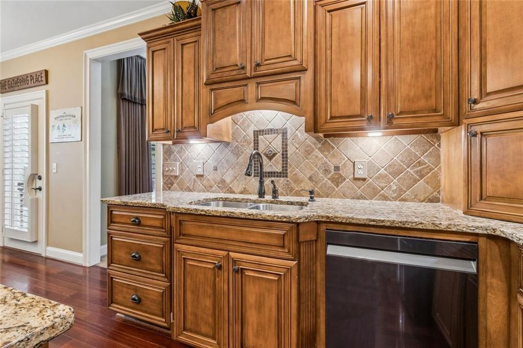 20 Stampede Pass Rydal, GA 30171 - Photo 30 of 77 a kitchen with cabinets appliances and a wooden floor
