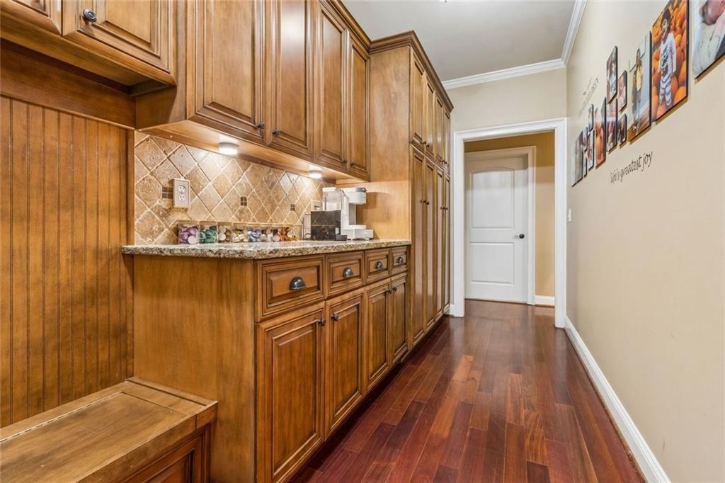 20 Stampede Pass Rydal, GA 30171 - Photo 31 of 77 a kitchen with stainless steel appliances granite countertop a sink and wooden cabinets