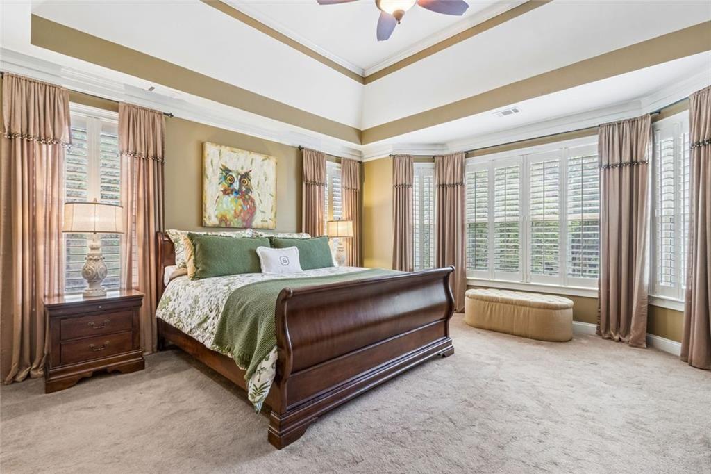 20 Stampede Pass Rydal, GA 30171 - Photo 32 of 77 a bedroom with a bed and glass walk in closet