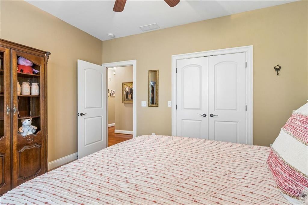 20 Stampede Pass Rydal, GA 30171 - Photo 41 of 77 a bedroom with a bed and a mirror