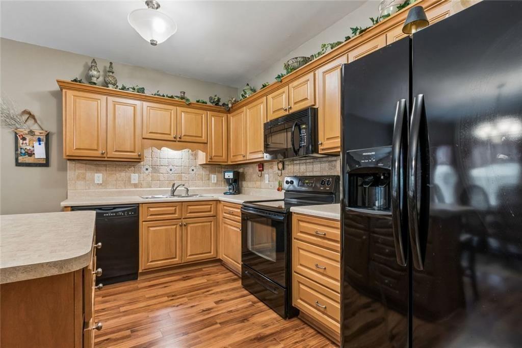 20 Stampede Pass Rydal, GA 30171 - Photo 55 of 77 a kitchen with kitchen island granite countertop stainless steel appliances cabinets a sink and a counter top space