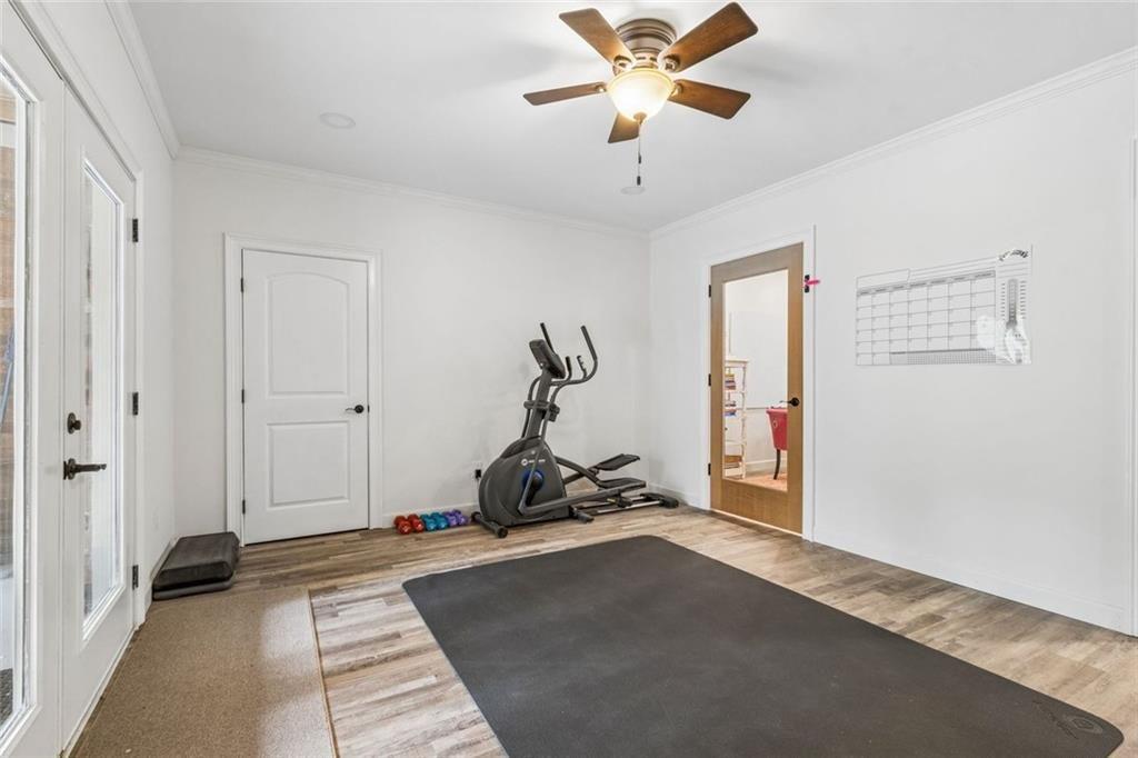 20 Stampede Pass Rydal, GA 30171 - Photo 67 of 77 a bedroom with a bed and a chandelier