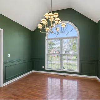 a kitchen with stainless steel appliances granite countertop a stove and a microwave oven