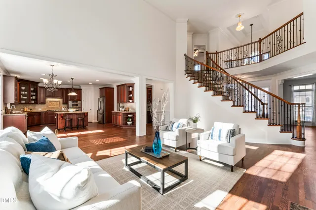 a large kitchen with a table and chairs in it