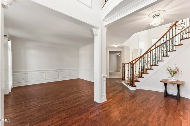 a room with wooden floor and window