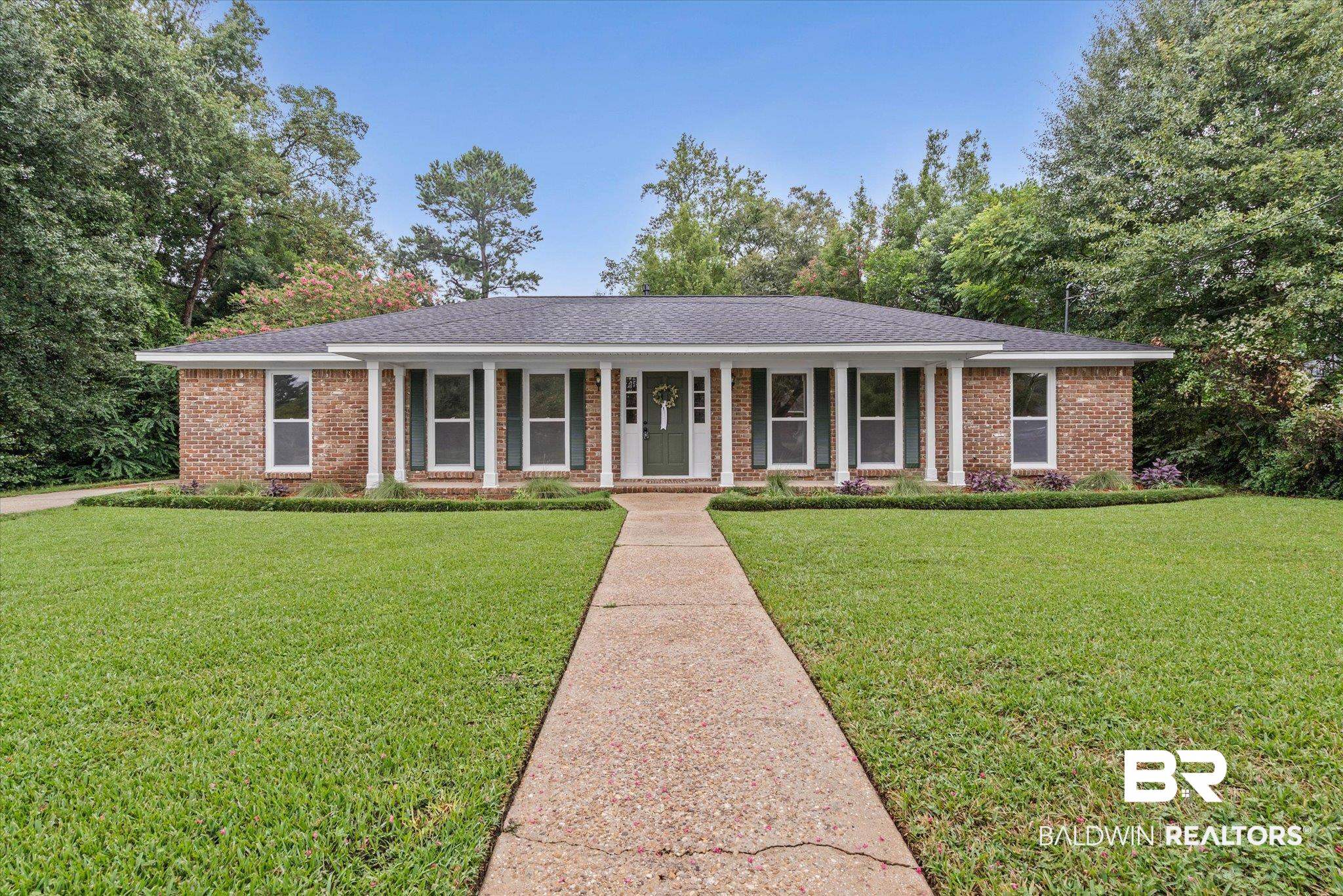 3655 Claridge Road South Mobile, AL 36608 - Photo 2 of 32 Single story home featuring a porch, brick siding, a front lawn, and roof with shingles