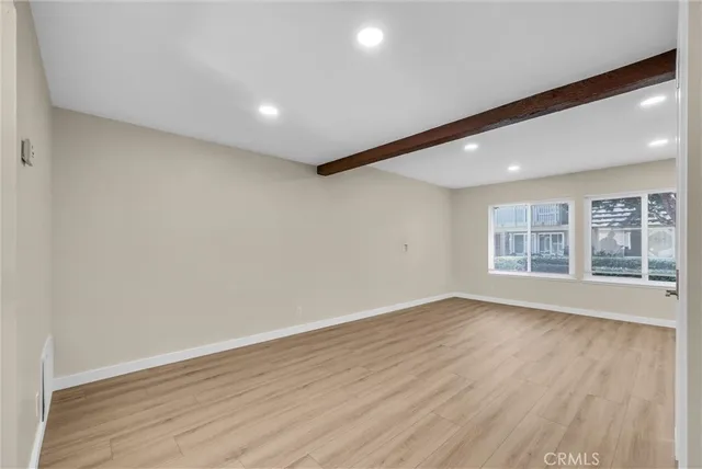 a view of kitchen with furniture and wooden floor