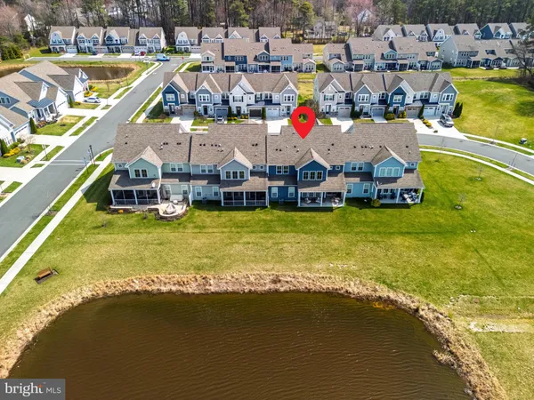 a view of a swimming pool with seating area and furniture