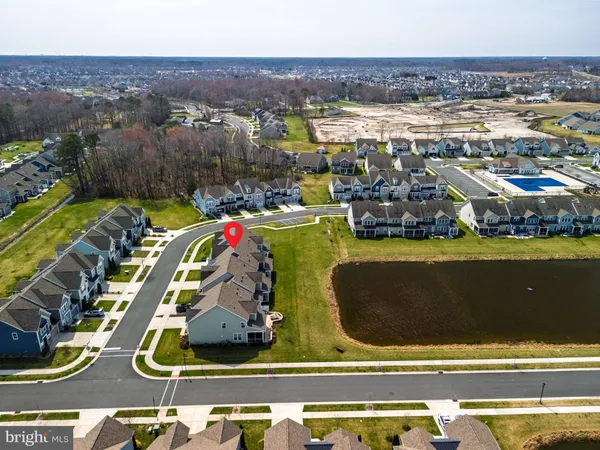 an aerial view of a house with a swimming pool