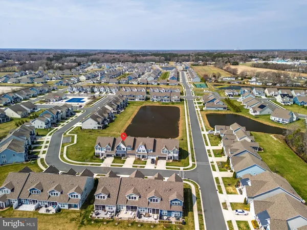 an aerial view of a with swimming pool and ocean view