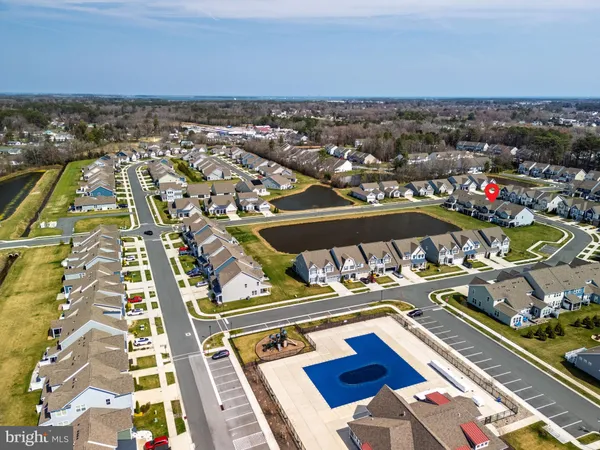 an aerial view of a house with a lake view