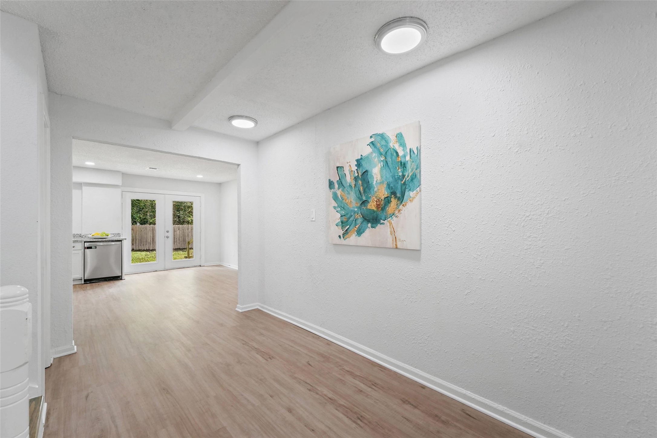 18009 Split Oak Circle New Caney, TX 77357 - Photo 11 of 30 wooden floor in an empty room with a window